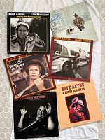 Six album fronts displayed