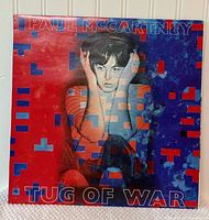 Front cover of Paul McCartney Tug of War LP showing artwork and title