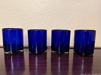 Front view of four cobalt blue tumblers