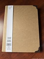 Front cover showing kraft board, label, and corner protectors
