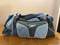 Full view of bag left side showing Speedo logo and color scheme