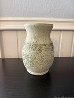 Full front view of speckled stoneware vase showing overall shape and glaze