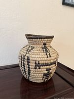 Front view of coiled basket showing overall shape and pattern