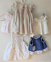 Group shot of all five dresses hanging