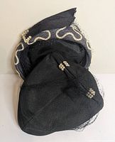 Both hats side by side showing general design and embellishments