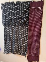 Both scarves hanging, showing patterns and size