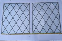 Both leaded glass panels side by side with measuring tape