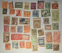 Full layout of roughly 40 assorted stamps showing variety of colours, countries and cancellations