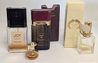 Group shot of all perfume bottles, case and box