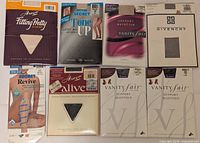 Front view showing eight retail packages of pantyhose