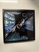 Framed Batman comic art print on wall