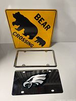 Overview showing Bear Crossing sign, chrome license plate frame, Eagles license plate