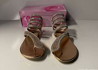 Top view of both sandals showing rhinestone straps and footbed