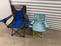 Adult and child folding camping chairs side by side