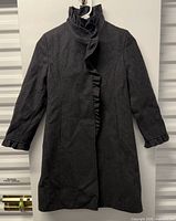Full front view of DKNY charcoal coat on hanger