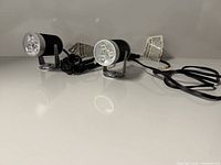 Both LED spotlights front view displaying lenses and mounts