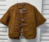 Full view of brown suede Members Only buckle jacket