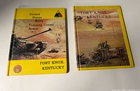 Both hardcover military books side by side