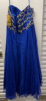Full view of royal blue embellished formal dress