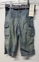 Front view of jeans with belt attached