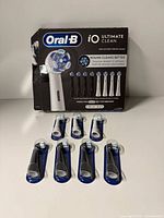 Front view of box and seven sealed brush heads