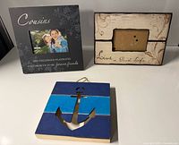 Three items: two sentiment photo frames and anchor wall plaque
