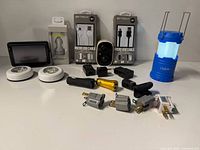 Group shot showing all electronics, chargers, cables, lantern, tap lights and adapters