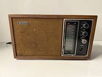 Front view of Sony tabletop radio showing grille, tuning panel and control knobs
