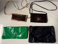 Four purses laid out showing overall styles and colors
