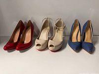 Three pairs of shoes side by side