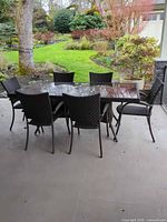 Full patio dining set showing table and six chairs