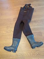 Full view of brown chest waders showing attached boots