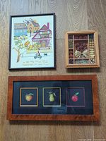 All three framed pieces laid out on floor