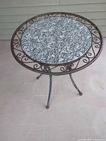 Full view showing granite top and scroll rim