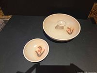 Both bowls top view showing size relationship and floral design