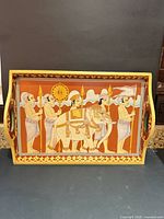 Top view of hand painted wood tray showing motif and handles