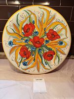Front view of ceramic plate showing entire floral design