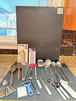 Full lot overview showing all utensils, gadgets and packaged items