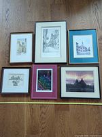 Overall view of six framed artworks laid out