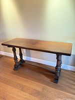 Full front view of console table showing overall design and finish