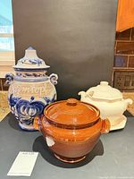 Group shot of Rumtopf jar, brown casserole, cream tureen