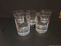 Group shot of five clear faceted rocks glasses