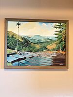 Full view of framed landscape painting on wall