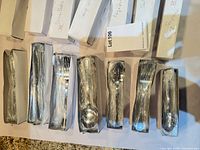 Individually boxed flatware pieces still wrapped