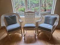 Full view of all three chairs lined up by window