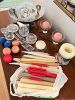 Overall lot showing candles, glass holders and metal stands