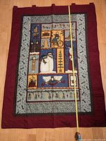 Front of quilted Christmas wall hanging with measuring tape