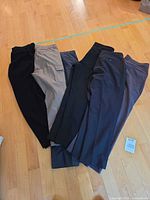 All six pairs of pants laid flat showing colour range and styles