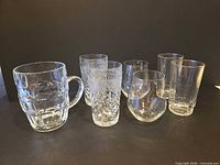Group shot of all seven clear glass pieces