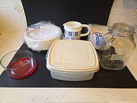 Group shot showing all containers, pitcher and paper plates